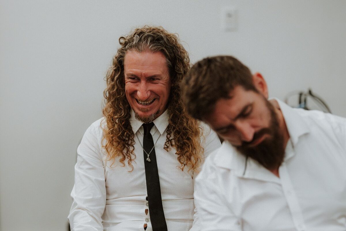 Two guests doubled over laughing