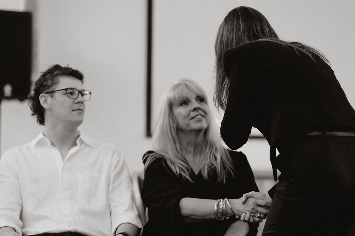 Krystal hypnotising a volunteer, black and white